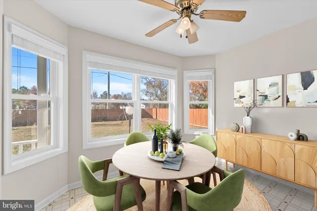 a view of a dining room with furniture window and outside view