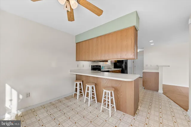 a kitchen with stainless steel appliances granite countertop a sink and a white cabinets