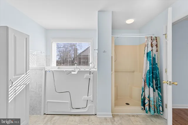 a bathroom with a glass shower door