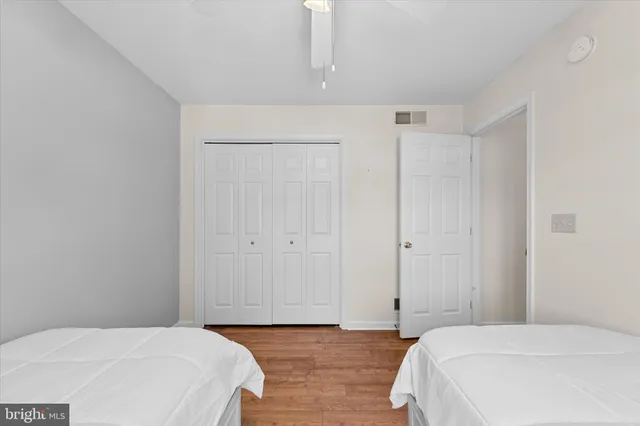 a bedroom with a bed and a closet