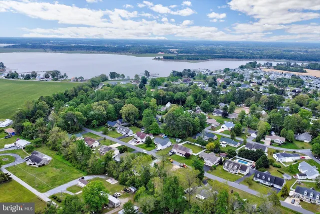 a view of swimming pool with sitting area and garden
