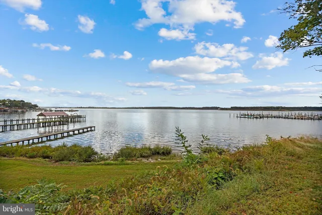 a swimming pool with outdoor seating and yard