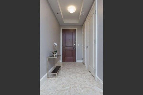 a hallway with white walls and entryway