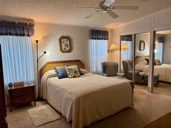 a bedroom with a bed and a closet