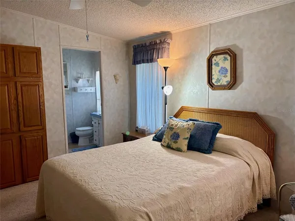 a bedroom with a bed and a closet