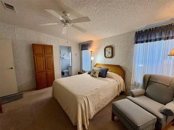 a bedroom with a bed and a couch