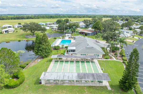 an aerial view of a house with a big yard