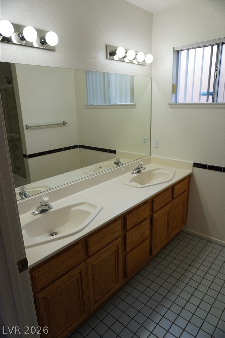 8328 Del Rey Avenue Las Vegas, NV 89117 - Photo 27 of 38 Double vanities with ample storage enhance this well-appointed bathroom.