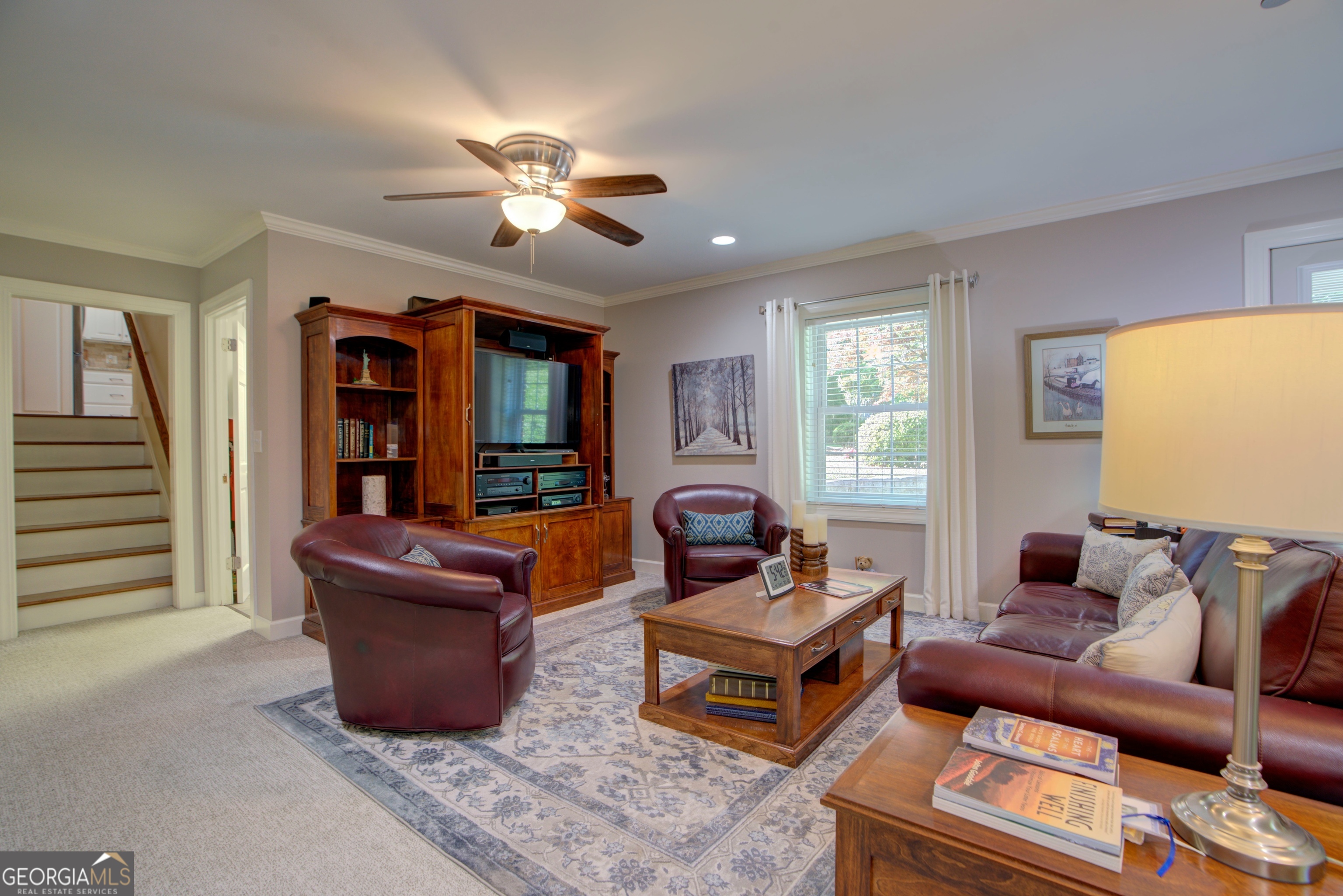 204 Green View Road Southwest Rome, GA 30165 - Photo 52 of 62 a living room with furniture a ceiling fan and a window