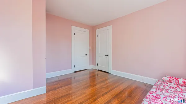 a view of room with hardwood floor