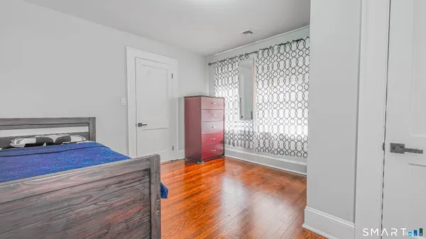 a view of a room with wooden floor