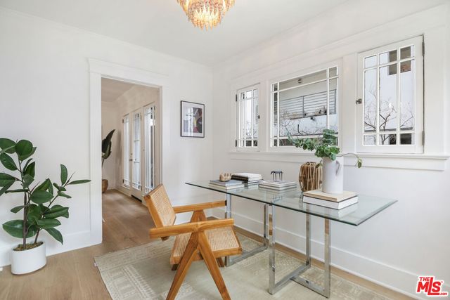 a dining room with furniture and wooden floor