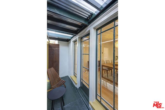 a hallway with couches and painted walls