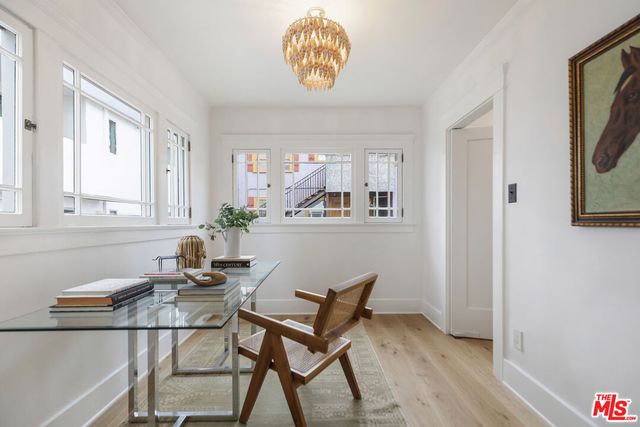 a dining room with furniture and window