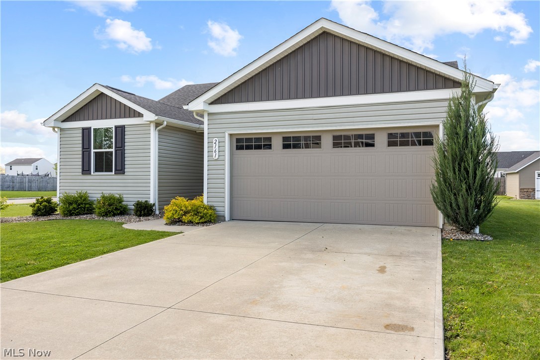2161 Fowl Road Elyria, OH 44035 - Photo 2 of 46 Exterior featuring light gray horizontal siding and dark gray vertical siding accents