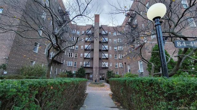 a view of a building with a yard