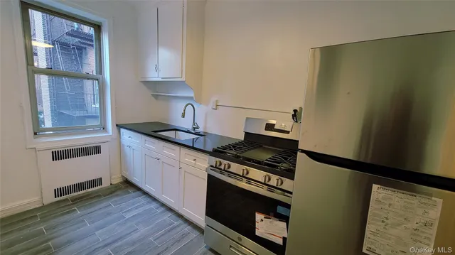 a kitchen with a stove and a refrigerator
