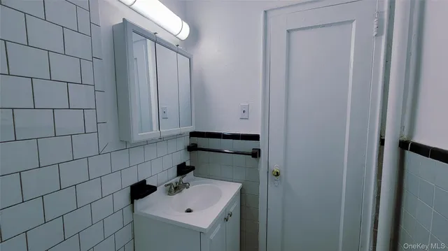 a bathroom with a sink and vanity