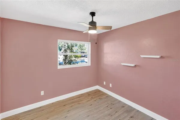 a view of a hallway with a window