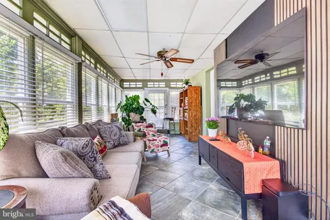 a room with furniture and a flat screen tv