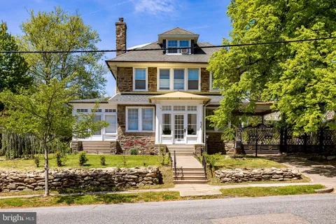 a front view of a house with swimming pool