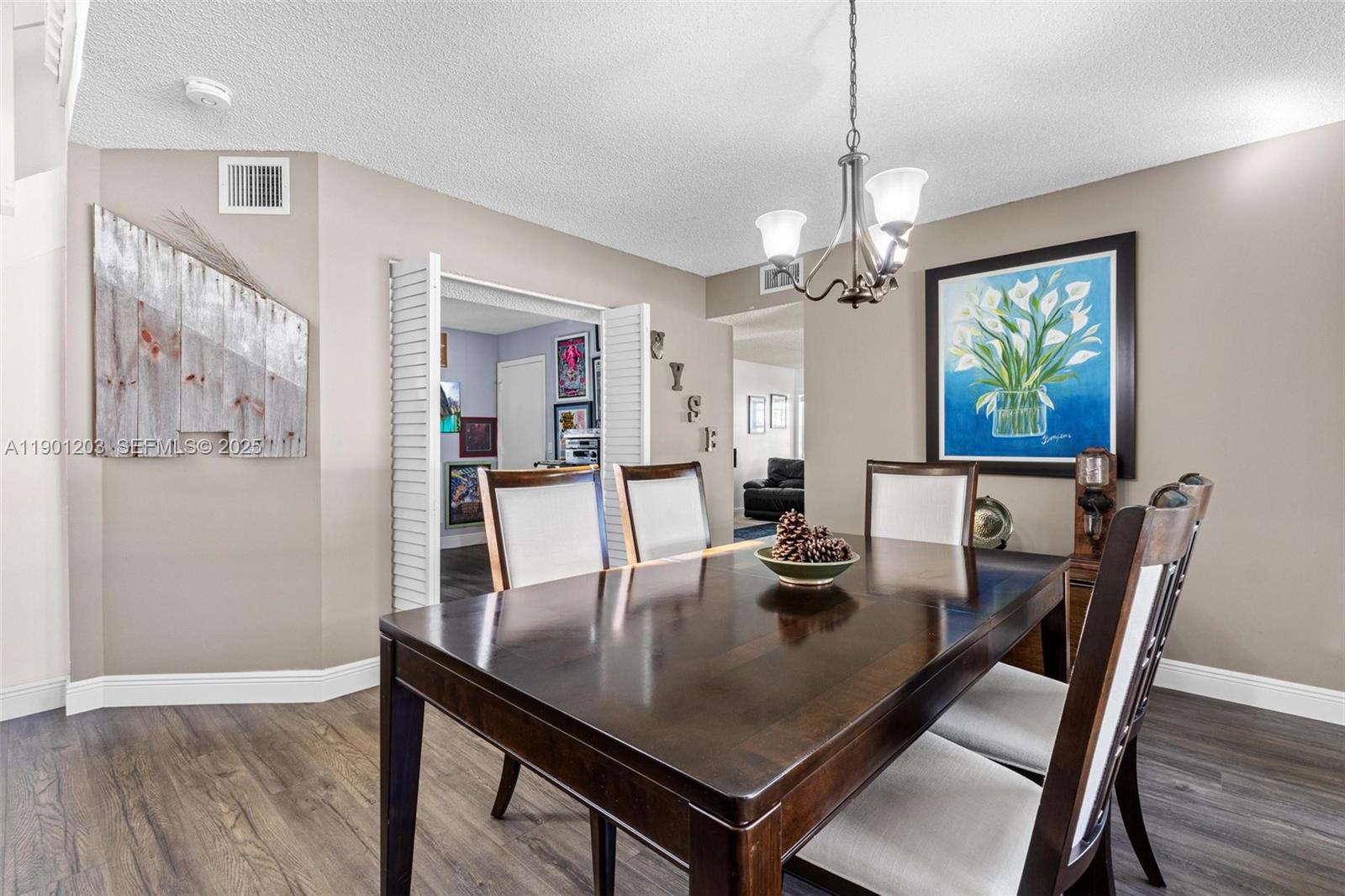 14683 Southwest 145th Terrace Miami, FL 33186 - Photo 12 of 47 a view of a dining room with furniture window and wooden floor