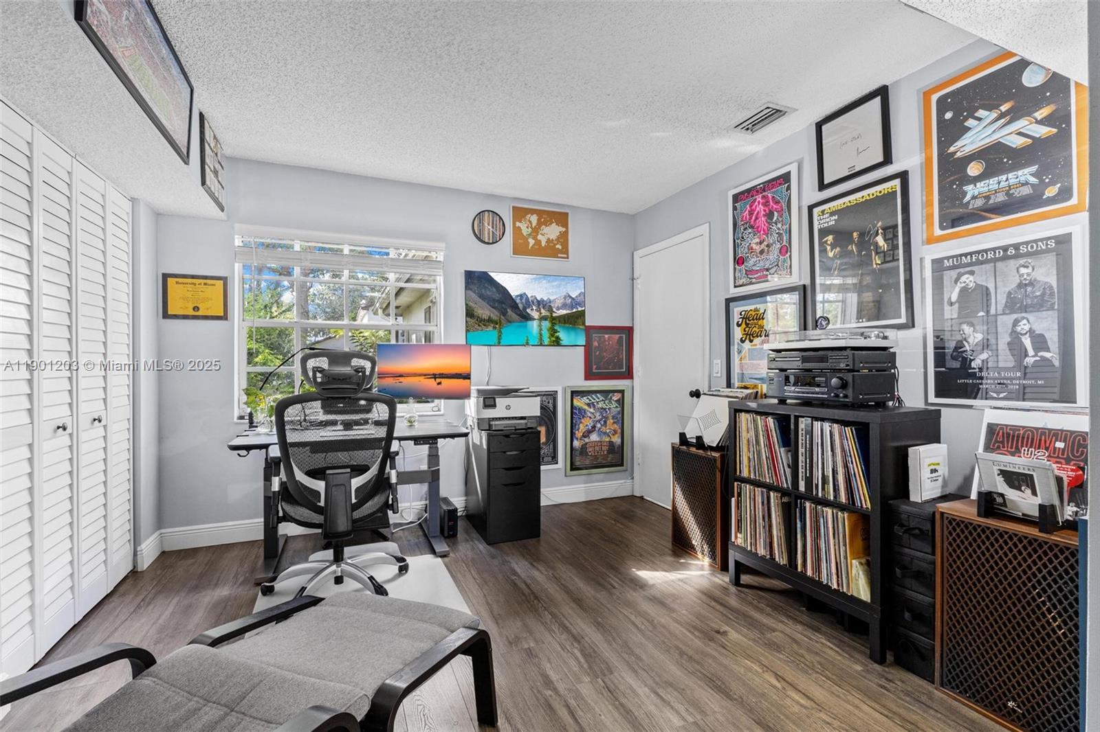 14683 Southwest 145th Terrace Miami, FL 33186 - Photo 13 of 47 a work room with furniture and wooden floor