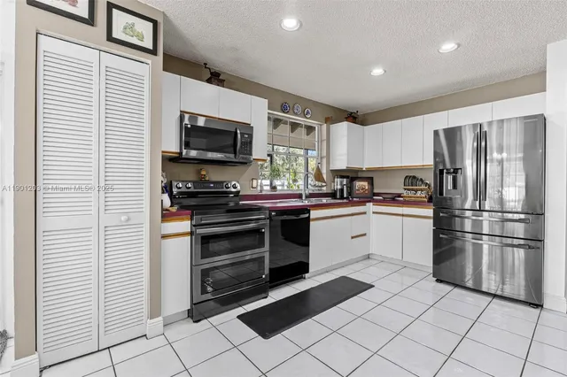 a kitchen with a stove and a microwave