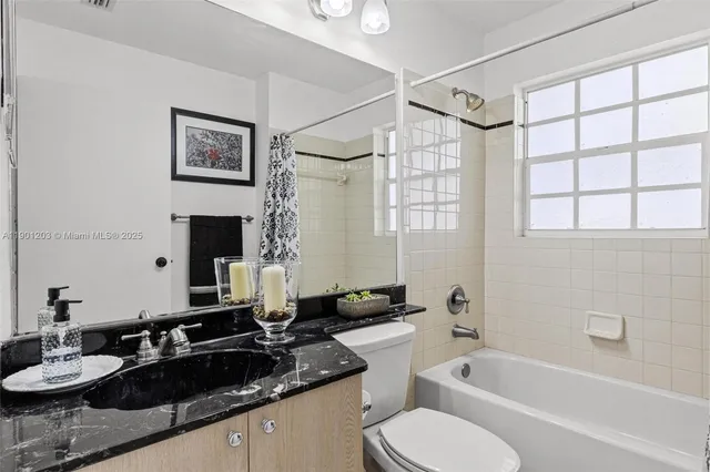 a view of washer and dryer with kitchen in the background
