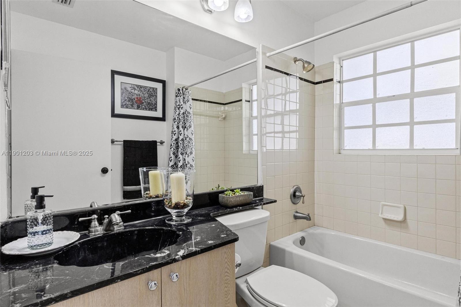 14683 Southwest 145th Terrace Miami, FL 33186 - Photo 19 of 47 a bathroom with a granite countertop sink mirror toilet and bathtub