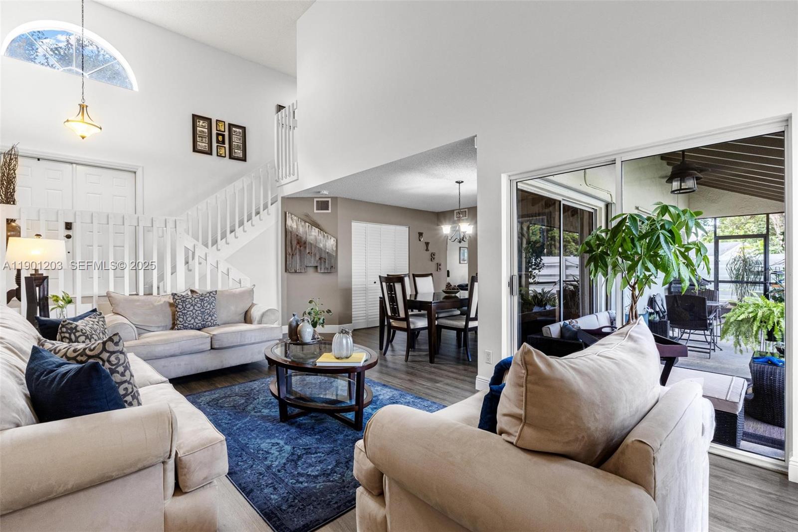 14683 Southwest 145th Terrace Miami, FL 33186 - Photo 2 of 47 a living room with furniture and a large window