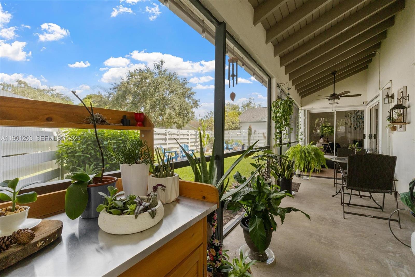 14683 Southwest 145th Terrace Miami, FL 33186 - Photo 22 of 47 a view of a patio with chairs and potted plants