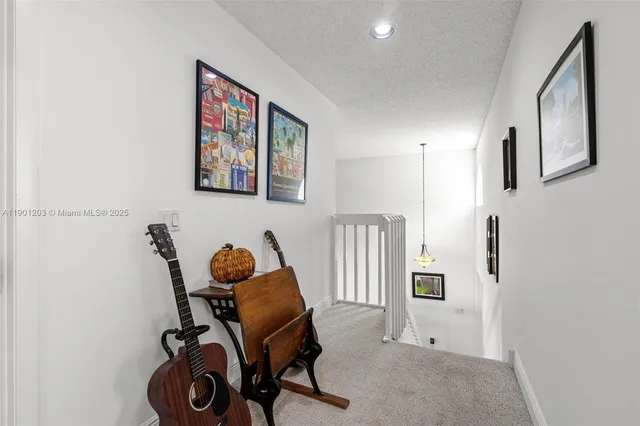 a bedroom with a bed a table and chair