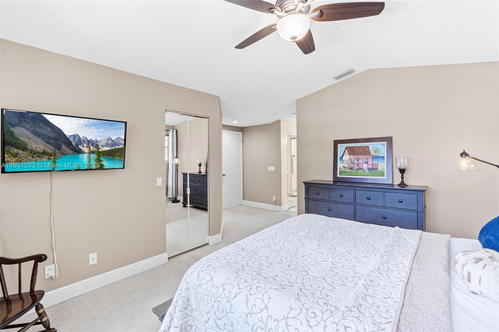 14683 Southwest 145th Terrace Miami, FL 33186 - Photo 25 of 47 a bedroom with a bed and a flat screen tv