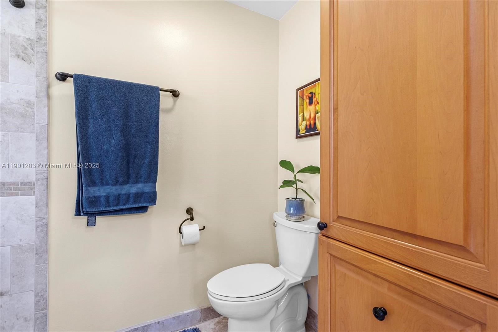 14683 Southwest 145th Terrace Miami, FL 33186 - Photo 27 of 47 a bathroom with a toilet and a shower curtain