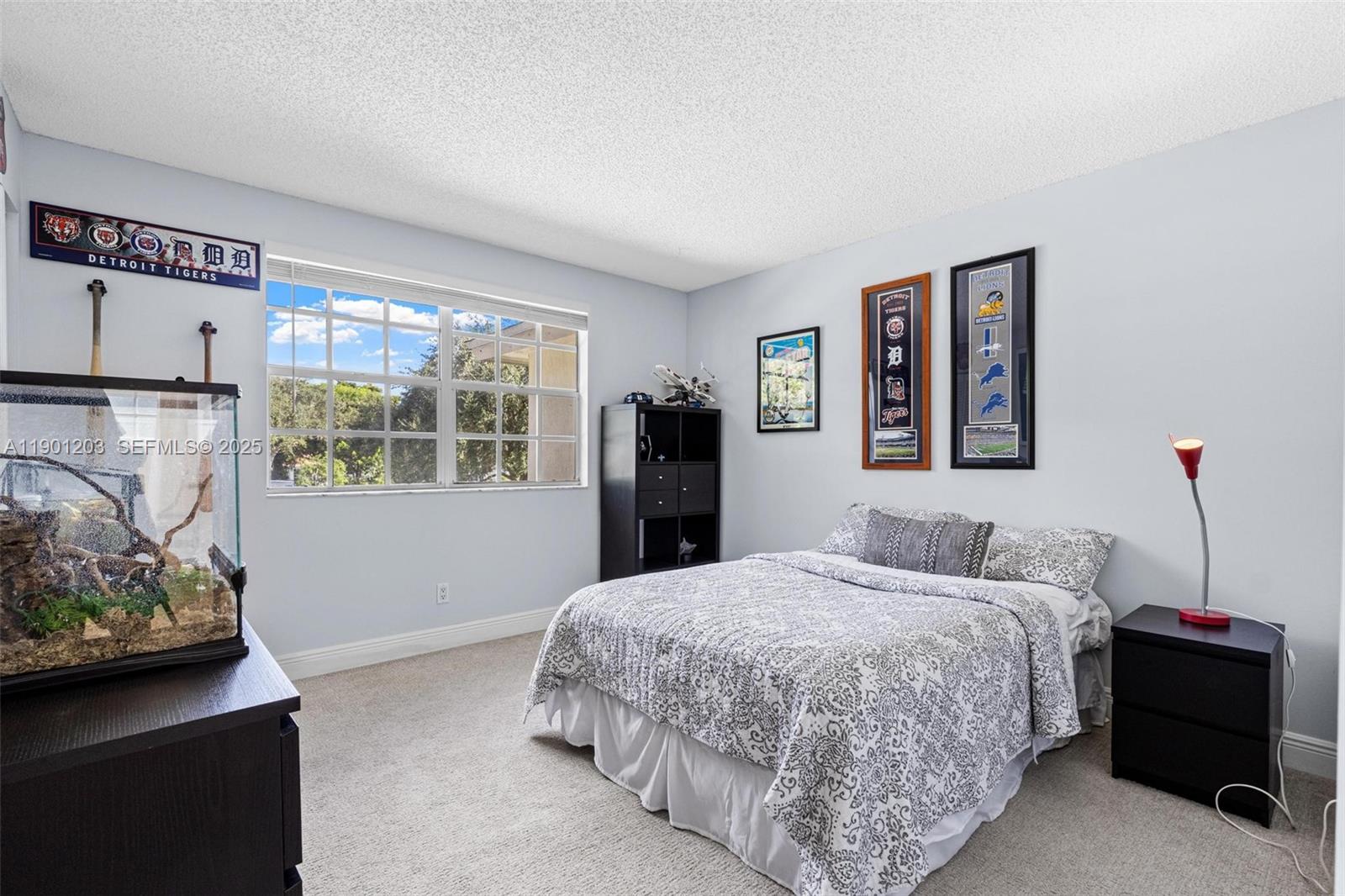 14683 Southwest 145th Terrace Miami, FL 33186 - Photo 29 of 47 a bedroom with a bed and a window