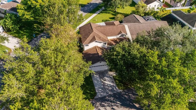 an aerial view of residential house with outdoor space and lake view