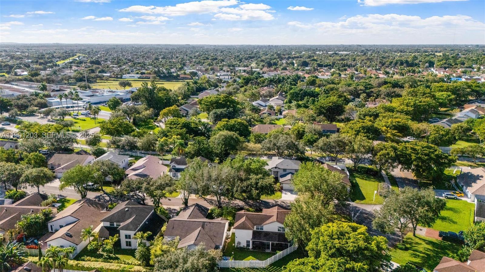 14683 Southwest 145th Terrace Miami, FL 33186 - Photo 45 of 47 an aerial view of residential houses with outdoor space and trees