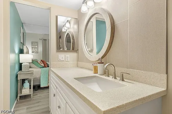 a bathroom with a sink and a mirror