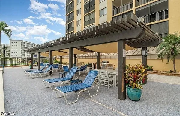 a view of a terrace with furniture and potted plants