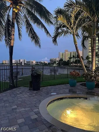 a view of a swimming pool with a patio