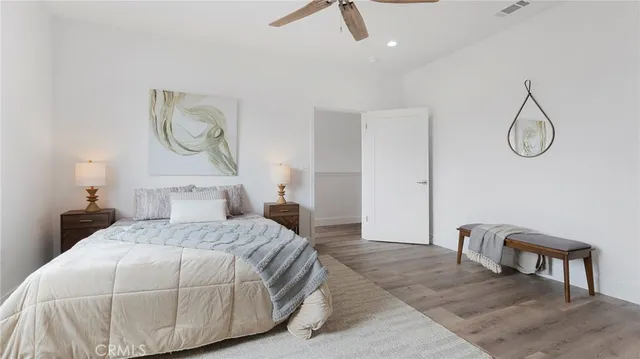 a bedroom with a bed and chandelier