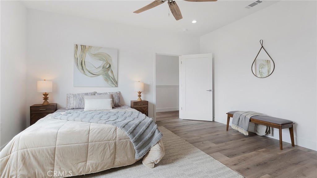 362 South Halcyon Road Arroyo Grande, CA 93420 - Photo 15 of 37 a bedroom with a bed and chandelier