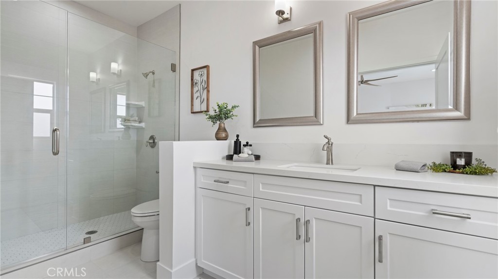 362 South Halcyon Road Arroyo Grande, CA 93420 - Photo 16 of 37 a bathroom with a granite countertop sink a toilet and shower
