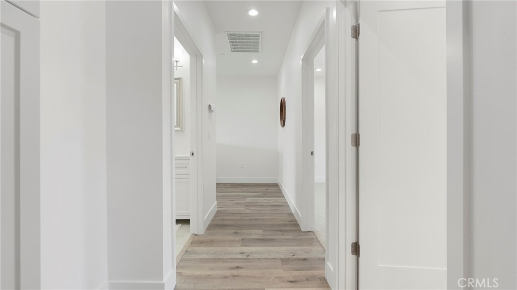 362 South Halcyon Road Arroyo Grande, CA 93420 - Photo 28 of 37 a view of a hallway with wooden floor and staircase