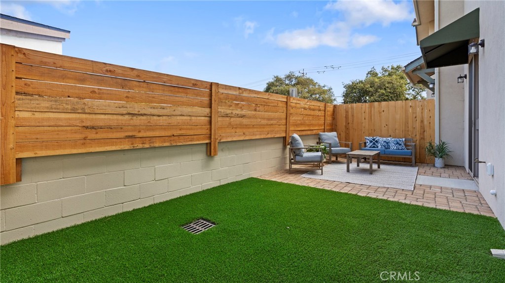 362 South Halcyon Road Arroyo Grande, CA 93420 - Photo 33 of 37 a view of a backyard with chairs potted plants and a patio