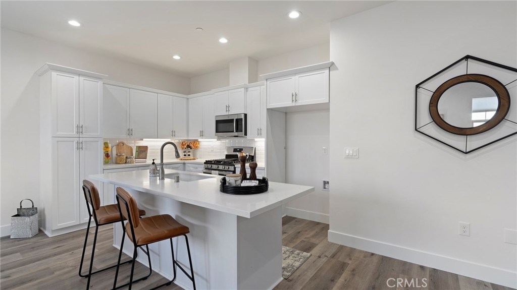 362 South Halcyon Road Arroyo Grande, CA 93420 - Photo 7 of 37 a kitchen with a dining table chairs and a refrigerator
