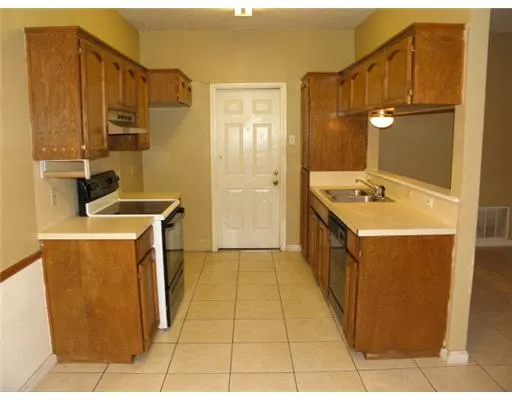 a bathroom with a sink a toilet a mirror and vanity