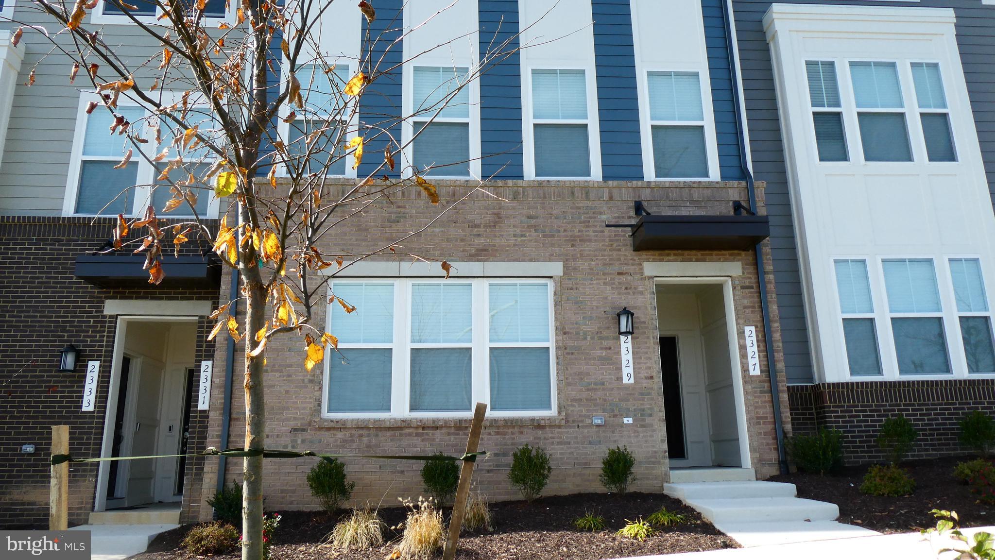 2329 Stephanie Tessa Lane Woodbridge, VA 22191 - Photo 1 of 50 a front view of a building