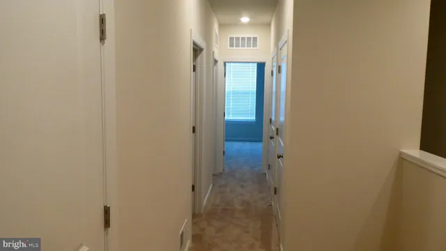 a view of a bathroom from a hallway